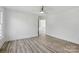 Bright bedroom featuring wood floors, white walls, and a ceiling fan at 13833 Jonathans Ridge Rd, Mint Hill, NC 28227