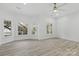 Spacious bedroom featuring three large windows and modern finishes at 13833 Jonathans Ridge Rd, Mint Hill, NC 28227