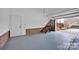 A spacious two-car garage with stairs leading to the home and ample space for parking and storage at 13833 Jonathans Ridge Rd, Mint Hill, NC 28227