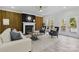 Bright living room with fireplace, wood accent wall, and neutral decor at 13833 Jonathans Ridge Rd, Mint Hill, NC 28227