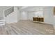 Open-concept living room with modern finishes and seamless flow to kitchenette at 13833 Jonathans Ridge Rd, Mint Hill, NC 28227
