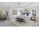 Spacious main bedroom with tray ceiling, stylish decor, and lots of natural light at 13833 Jonathans Ridge Rd, Mint Hill, NC 28227