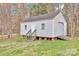 A spacious storage shed in backyard with double doors, windows, and ample space for all tools and lawn equipment at 13833 Jonathans Ridge Rd, Mint Hill, NC 28227