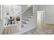Inviting foyer with staircase and views of the dining area, perfect for welcoming guests at 13833 Jonathans Ridge Rd, Mint Hill, NC 28227