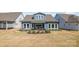 Landscaped backyard with a patio area perfect for outdoor entertainment and relaxation at 1447 Encore Ln, Waxhaw, NC 28173