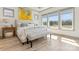 Serene bedroom with large windows showcasing scenic natural views at 1447 Encore Ln, Waxhaw, NC 28173