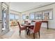 Charming dining area with a wood table and large windows offering natural light at 1447 Encore Ln, Waxhaw, NC 28173