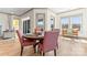 Bright dining area with wood table, comfortable seating and scenic outdoor view at 1447 Encore Ln, Waxhaw, NC 28173