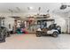 Well-organized garage with epoxy flooring, storage solutions, and a golf cart at 1447 Encore Ln, Waxhaw, NC 28173
