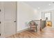 Upstairs hallway with wooden banister and chair at 1447 Encore Ln, Waxhaw, NC 28173