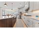 A modern kitchen with stainless appliances, white countertops and custom cabinets at 1447 Encore Ln, Waxhaw, NC 28173