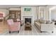 Elegant living room with fireplace, neutral color palette, and hardwood flooring at 1447 Encore Ln, Waxhaw, NC 28173