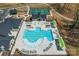 Aerial view of the community pool and amenities with ample seating and lounge chairs at 1447 Encore Ln, Waxhaw, NC 28173
