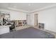 Large bedroom with bookshelves, and a comfortable spot for a workspace at 15616 Parkside Crossing Dr, Charlotte, NC 28278