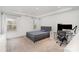 Comfortable bedroom with a tray ceiling, a bed, and a sleek modern desk at 15616 Parkside Crossing Dr, Charlotte, NC 28278