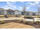 Well-maintained community green space featuring benches and manicured landscaping at 15616 Parkside Crossing Dr, Charlotte, NC 28278