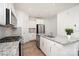 Bright, modern kitchen featuring granite countertops, stainless steel appliances and white cabinetry at 15616 Parkside Crossing Dr, Charlotte, NC 28278