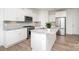 Modern kitchen with stainless steel appliances, granite countertops, and white cabinetry at 15616 Parkside Crossing Dr, Charlotte, NC 28278