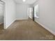 The carpeted bedroom has ample sunlight and a ceiling fan for added comfort at 1638 Pineburr Ln, Rock Hill, SC 29730