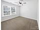 Well lit bedroom featuring a large window and ceiling fan at 1638 Pineburr Ln, Rock Hill, SC 29730