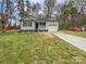 Charming single-story home with well-manicured lawn and inviting front porch and a one car garage at 1638 Pineburr Ln, Rock Hill, SC 29730