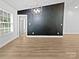 Bright living room with a feature wall, chandelier, and an open floor plan at 1638 Pineburr Ln, Rock Hill, SC 29730