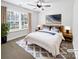 Inviting bedroom featuring a large window, ceiling fan, and cozy furnishings at 1638 Pineburr Ln, Rock Hill, SC 29730