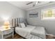 Cozy bedroom features a comfortable bed, side table, and ample natural light from a window at 1657 Bowater Rd, Rock Hill, SC 29732
