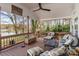 Covered porch with ceiling fan, lake view, plenty of seating, and wood flooring at 1657 Bowater Rd, Rock Hill, SC 29732