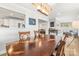 Spacious dining room featuring hardwood table, stylish lighting, and convenient access to the kitchen at 1657 Bowater Rd, Rock Hill, SC 29732