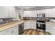 Bright kitchen with stainless steel appliances, white cabinets, and ample counter space perfect for cooking at 1657 Bowater Rd, Rock Hill, SC 29732