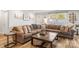 Comfortable living room featuring a large sectional sofa, a coffee table, and natural light from the windows at 1657 Bowater Rd, Rock Hill, SC 29732