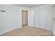 A carpeted bedroom features two closets and access to two separate rooms at 1814 Saint Louis Nw Aly, Concord, NC 28027