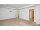 The carpeted bedroom features a media outlet and access to two separate rooms at 1814 Saint Louis Nw Aly, Concord, NC 28027