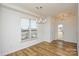 Sun-filled dining room with hardwood floors and modern lighting at 1814 Saint Louis Nw Aly, Concord, NC 28027