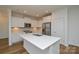 Modern kitchen with quartz counters, island, and stainless steel appliances at 1814 Saint Louis Nw Aly, Concord, NC 28027