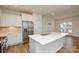 Bright kitchen featuring quartz counters, island, and stainless steel appliances at 1814 Saint Louis Nw Aly, Concord, NC 28027