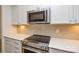 Elegant kitchen featuring stainless steel appliances and quartz countertops at 1814 Saint Louis Nw Aly, Concord, NC 28027