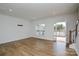 Well lit living room featuring a sliding glass door and hardwood floors at 1814 Saint Louis Nw Aly, Concord, NC 28027
