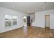 Bright living room with hardwood floors and large windows at 1814 Saint Louis Nw Aly, Concord, NC 28027