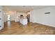 Beautiful kitchen and living area with hardwood floors and stainless appliances at 1814 Saint Louis Nw Aly, Concord, NC 28027