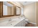 Bright bathroom with double vanity, two mirrors, and neutral color palette at 1838 Summit Ridge Ln, Kannapolis, NC 28083