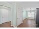 Open-concept view of dining area with white doors, tile floor, and natural light at 1838 Summit Ridge Ln, Kannapolis, NC 28083