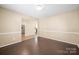 Dining room with hardwood floors, chandelier, and easy access to the adjacent kitchen at 1838 Summit Ridge Ln, Kannapolis, NC 28083