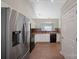 A bright and modern kitchen with stainless steel refrigerator and black oven at 1838 Summit Ridge Ln, Kannapolis, NC 28083