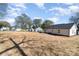 View of the large backyard, featuring newly installed lawn and views of the home at 206 W 19Th St, Kannapolis, NC 28081