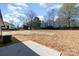 Large backyard with newly seeded lawn, patio, and privacy fence is ready for entertaining and play at 206 W 19Th St, Kannapolis, NC 28081