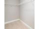 Walk-in closet features wire shelving, neutral walls, white trim and plush carpet at 206 W 19Th St, Kannapolis, NC 28081