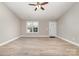 Bright and airy living room showcasing sleek, modern floors and a view of the front entryway at 206 W 19Th St, Kannapolis, NC 28081