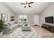 Bright living room featuring a light gray sofa, neutral walls, and modern decor for a cozy feel at 206 W 19Th St, Kannapolis, NC 28081